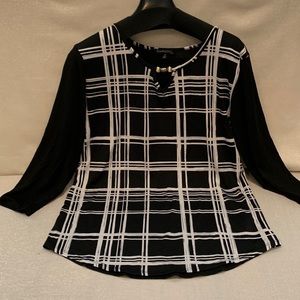 Simplicity by Azul. Black/White Big checkered print with solid Black Back.